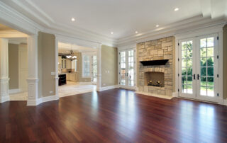 Living Room hardwood floor With Stone Fireplace